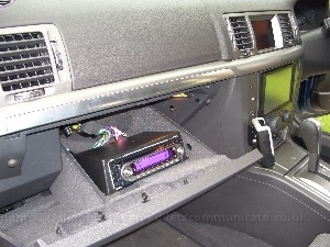 iceinstalledinglovebox2.jpg - Here you can see a shot of the din adaptor and my head unit ( the old Kenwood ). I did buy a new Blaupunkt unit with a Canbus adaptor how ever it seems even though its sposed to be it was not compatible with my car. This caused several weeks ( long story ) of delays and was one of the main reasons I missed the 2008 Digital-car show. I will revisit this situation at some point